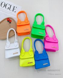 Children fluorescent color handbags girls candy colorful PU leather single shoulder bag kids metals letter applique messenger bags9929014
