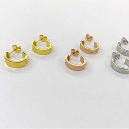 Trendy nail style earrings Jewellery with engraved 18K gold classic circular for men and women with cart original earrings