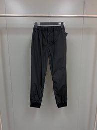 2024 Spring/Summer Nylon Spliced Casual Long Pants with Metallic Triangle Emblem on Back Pocket - Euro Sizes