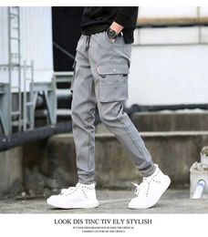 Men's Pants Fashionable solid Colour pants multi flap pocket mens cargo pants loose casual outdoor pants mens work pantsL2404