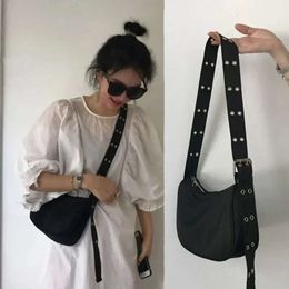 "New Nylon Bucket Bag: Fashionable and practical. Solid zipper, soft shoulder straps. Designer black tote for women. Shop now!