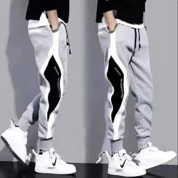 Men's Pants New mens jogging fitness pants patch work elastic waist windproof ankle sports pants mens fashion casual bag fully matched TrousersL2404