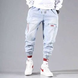 Men's Pants Street fashion hip-hop merchandise pants mens jeans elastic pockets harem pants mens sports joggers Korean fashion ankle strap denimL2403