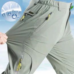 Men's Pants SFABL 5XL Summer Quick Drying Hiking Pants Mens Elastic Waterproof Tactical Pants Zipper Pocket Trousers Light Fishing PantsL2404