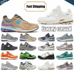 Designer Sneakers 2002r Running Shoes Athletic Womens Mens Casual Jogging Sneaker on Rain Cloud Pink Grey Brown