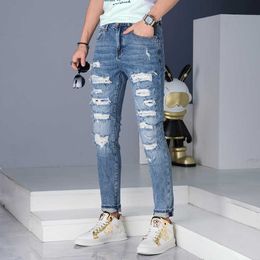 Spring/summer 2023 Jeans Mens Tears Scratched European Slim Fit Small Feet Pants Blue Washed Trendy