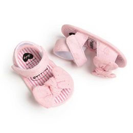 Sandals Baby girl anti slip bow sandals with breathable soft soles for young children. First walking shoe with baby hollow design sandalsL240429