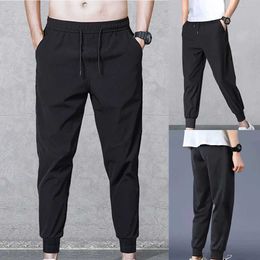 I pantaloni da uomo migliorano il tuo aspetto casual con maschi di abbigliamento da abbigliamento da jogger per il carico pantaloni sport (XL 4xl) Q240429