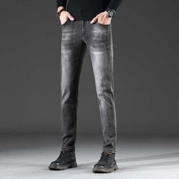 Pantaloni casuali di jeans grigi europei di marca alla moda di marca alla moda slim fit piccolo piede lungo autunno e inverno