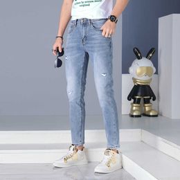 Fashion European Brand High End Light Luxury Spring/summer Water Washed Style Slim Fit Casual Small Feet Perforated Elastic Jeans for Men