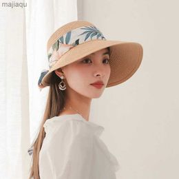 CAPS HATS WOMENS BEACH HAT SUMMER BOHEMIAN SUN PRUSTIUNED SLANTED BRIMMED HAT BOW PENDANT SUN HAT EAGLE SLANTED WOVEN FISHENMAN HATL240429