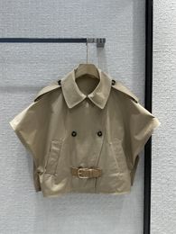 A cape style trench coat with a stylish flip collar and double breasted design. The silhouette is casual, cool, and fashionable