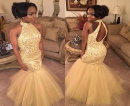 2019 High Neck Puffy Mermaid Cheap Prom Dresses Long Yellow Tulle Bling Sequins Backless Evening Party Major Beading Gown5061550