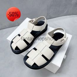 The Row hollow TR Roman design Baotou Small shoes leather Spring and summer new comfortable buckle flat sandals for women OUDJ