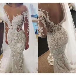 Sexy Back 2020 Crystals Dresses Mermaid Hollow Covered Buttons Long Sleeves Sheer Neck Custom Made Wedding Bridal Gown