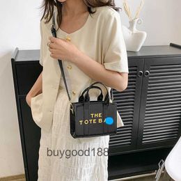 Designer Marcj Original Edition Tote Bag New Womens One Shoulder Crossbody Bag Instagram Solid Color Laser Small Square Fashionable and Simple Commuting Handbag