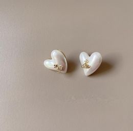 E022 Small fashionable temperament heartshaped women039s Pearl Earrings9331812