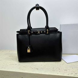 Sell Top Quality Leather Designer Bag Triumphal Arch Womens Bag With Lock Luxurys Handbags Large Capacity Briefcase Portable Tote Bag 230815