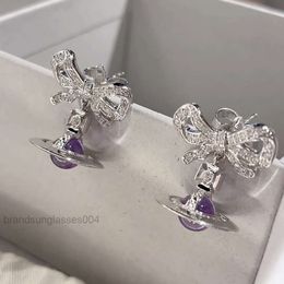 Designer Luxury Jewellery VivienenWestwoods Satellite Viviane Westwood Empress Dowager Western Purple Bowknot Stereo Planet Earrings Female Gold Full Diamond Zir