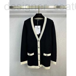 Women's Sweaters designer 2024 early spring new Nanyou Cha British style double pocket single breasted black and white contrasting V-neck knitted cardigan 31MH