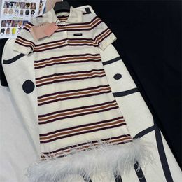 Basic Dresses Designer Luxury 24 Early Spring New Miu Fashion Age Reducing Contrast Stripe Spliced Feather Polo Neck Knitted Short Sleeved Dress Wsgn