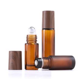 Roll On Bottles Wholesale 5Ml 10Ml 15Ml Amber Glass Roll-On Wood Grain Plastic Cap Frosted Essential Oil Per Bottle With Stainless S Dh3Rg