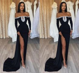 2024 Sexy Prom Dresses Black Off Shoulder Long Sleeves Plus Size Mermaid Floor Length Side Split Illusion Crystal Beads Pearls Formal Evening Gowns