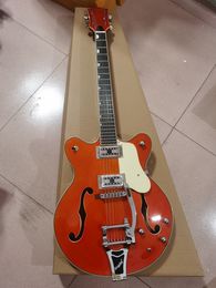 Swiss orange-red electric guitar, white electronic hardware, body semi-hollow, double F-holes, in stock, high-grade bridge