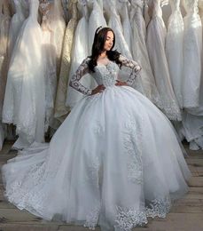 2024 Modern Arabic Ball Gown Wedding Dresses Illusion Neck Long Sleeves Lace Appliques Plus Size Formal Bridal Gowns Hollow Back Sweep Train