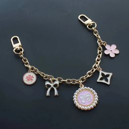 Golden luxury bag charm chain keychain for women Pink flower pendant decoration accessory metal buckle 240122