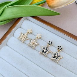 New fashion luxury commuter niche inlaid enamel glaze rhinestone logo five-pointed star shape metal earrings wholesale