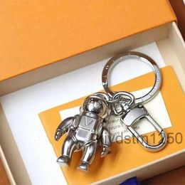 Keychain Designer Luxury Metal Sense Design Humanoid Fashion Casual Style Key Chain Versatile Popular Hanging Bag Phone Case Very Good LEUC