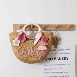Totes Cute camellia Thai straw bag 2022 new niche design natural hand-held rattanH24217