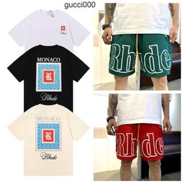 Rhude T shirt Designer Mens Women Man Tshirts Clothing Graphic Tees Pattern Tops Summer Short Sleeve Tshirt Hip Hop Letters Graffiti Print Loose shirts Causal WVMJ