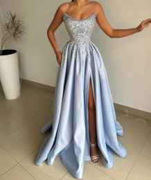 2024 Sexy Evening Dresses Wear Strapless Light Blue Sequins Lace Appliques Crystal Beads Pearls Satin Side Split Sleeveless Ball Gown Prom Gowns Evening Gowns