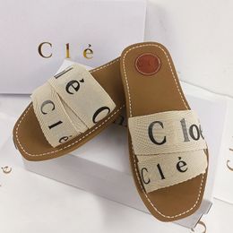 Designer tofflor Woody Sandals Tyg Canvas Letters Luxury Brand Slides Flat Sandals Bekväm trendig fashionabla öppet Toed Outdoor Home Sand Slipper