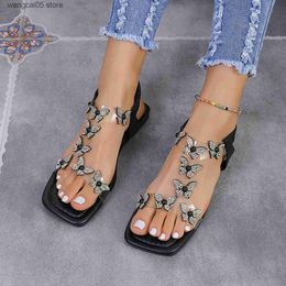 Sandals Large butterfly rhinestone flat bottomed sandals for womens new elastic band hollow beach sandals T240220