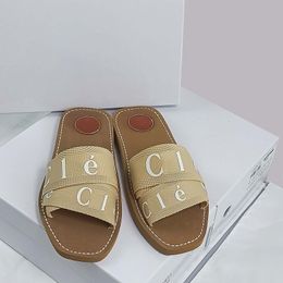 Дизайнерские тапочки Woody Sandals ткани Canvas Letters Luxury Flides Flat Sandals Комфортные модные модные открытые пальцы 001