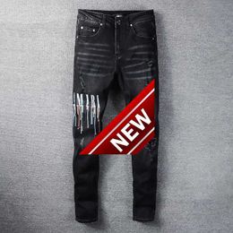 Mens Korean version high street fashion young men black letter paint dot micro large jeans mens trousers