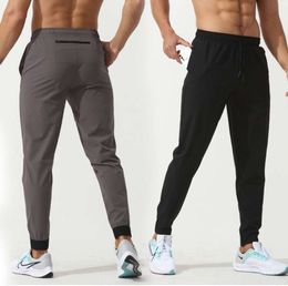 LU Womens LL Mens Jogger Long Pants Sport Yoga Outfit Quick Dry Drawstring Gym Pockets Sweatpants Trousers Casual Elastic Waist Fitness Leggings High Quality4535