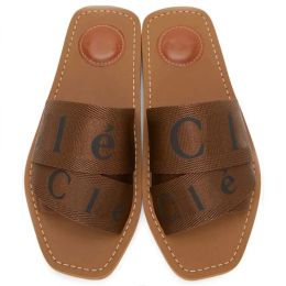 designer slippers sliders slides sandals woody flat mule signature adorns the inner sole The easy slip-on design makes this flat summer essentia L6