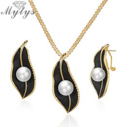 Mytys Pearls Necklace On Black Leaf Jewellery Sets For Women Retro Romantic Gold Wire Frames Leaf Pendant Earrings CE611CN540199k