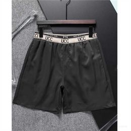 Designer Designer mens shorts black and white European and American luxury style stitching brand pure cotton antiwrinkle breathable quick dry beach swimming trunk