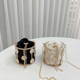Evening Bags French Niche Rhinestone Pearl Handbag for Women with a High End Feel Metal Hollowed Out Bird Cage Bag Flower Inlaid Diamond Dinner Bag 240227