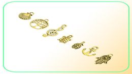 Mixed Designs Retro Golden Color Key Rudder Shell Turtle Bird Hand Tower Bike Butterfly Owl Charms For DIY Jewelry Fitting 50pc1322769