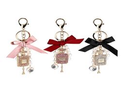 Keychains Fashion Imitation Pearl Perfume Bottle Keychain Car Key Ring Holder Bag Charm Pendant Accessories Bow Keyfob Women Keyri9402954