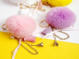 Keychains 2021 Lovely Eiffel Tower Natural Fur Pompom Furry Ball Keychain For Women Key Chains Bag Imititated Pearl Pendent D5215914627