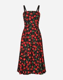 Cherry silk suspender dress with black background
