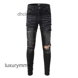 Jeans designer Amirrss Men New versatile washing hole sticking leather embroidery slim fit Leggings jeans trousers men's high street fashion AV14