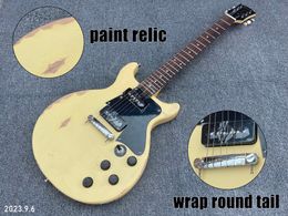 Electric guitar solid mahogany body and neck yellowish relic rosewood fingerboard dots inlay black pickguard